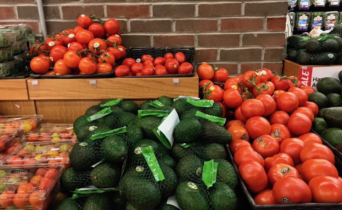 Fruits and vegetable stands at a supermarket.