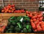 Fruits and vegetable stands at a supermarket.